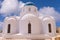 Santorini Greece Church with bells and cross against blue sky