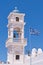 Santorini Greece Church with bells and cross against blue sky