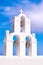 Santorini Greece Church crosses and bells against blue sky