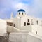 Santorini, Greece. Conceptual composition of the famous architecture of the island of Santorini. White church with a blue dome.