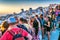 SANTORINI, GREECE - JULY 12, 2014: Tourists enjoy sunset in Oia