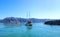 Santorini, Greece. Tour boats criss-crossing in the Santorini Caldera sea. Thira city in the hilltop background.