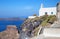 Santorini - The little church in Imerovigli over the Skaros and Therasia island