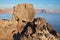 Santorini - look to caldera across the pumice boulders with the Scaros ans Imerovigili in the background.