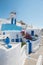 Santorini - look to windmill and little typically white-blue chapel in Oia.