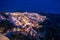 Santorini at Night, one of the most beautiful travel destinations of the world. Panoramic View at the Capital of the island, Fira