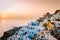 Santorini Oia Greece Europe, sunset at the white village of Oia Santorini with old blue and white Greek churches at dusk