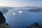 Santorini - The outlook over the Imerovigili to caldera with the cruises and Nea Kameni Island in morning