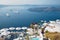 Santorini - The outlook over the luxury resort in Imerovigili to caldera with the cruises and Na Kameni