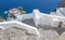 Santorini - The restaurant geared to wedding romantic diner in Oia (Ia) and the yacht under cliffs