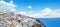 Santorini skyline panorama. Beautiful Santorini landscape against sky clouds