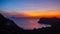 Santorini sunset with seaside and mountain island view. Akrotiri, Greece. Night landscape. Traveling concept