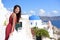 Santorini tourism - Asian woman on summer travel