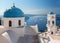 Santorini - The tower of Anastasi church in Imerovigli with the cruises in background