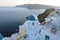 Santorini traditional greek white village with blue domes of churches, Greece