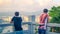 Sanya, Hainan, China - May 16, 2019: two young unidentified guys look at the panorama of Sanya