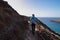 Sao Lourenco - Hiker woman on idyllic hiking trail along rocky rugged cliffs at Ponta de Sao Lourenco peninsula, Canical