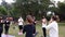 Sao Paulo, Sao Paulo/Brazil, on july 04, 2021. Camera circling yoga practitioners saluting in a public park_loop