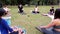 Sao Paulo, Sao Paulo/Brazil, on july 04, 2021. Yoga teacher giving explanations to his practitioners in a public park