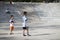 Sapa, Lao Cai, Vietnam - 08 17 2014: Two vietnamese kids playing soccer with jersey shirts of Germany and Argentina in Sa Pa, Lao