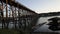 Sapan Mon Bridge, wooden bridge stretching across the river in afternoon at Sangkhlaburi district, Kanchanaburi, Tha