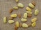 Sappanwood seeds on jute background - Unripe and dry