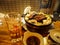 Sapporo, Hokkaido, Japan - Jingisukan, or Genghis Khan, a Japanese grilled mutton dish prepared on a convex metal skillet.