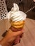 Sapporo, Hokkaido, Japan - White soft ice cream made of fresh milk on a bread cone.