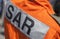 SAR Search and Rescue logo on a pilot from a rescue helicopter