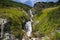 Sarafiovy Waterfall - steep rocky and grassy trough - Sarafiovy stream flows sharply until it turns into a cascading waterfall