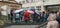 Sarajevo, Bosnia and Herzegovina, March 8, 2020. A group of tourists listening to the guide. It is raining, people are standing