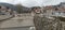 Sarajevo, Bosnia and Herzegovina - March 8, 2020: Sheher bridge over the Milatsk river. Spring. Turbid water in the river and bare