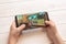 Sarajevo, Bosnia and Herzegovina - November 30, 2019: Garena Free Fire video game on Samsung Galaxy S9 plus smarthone in kid hands