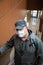 Saratov, Russia - 10/04/2020: One middle-aged 40-45 European man wearing a properly worn white medical mask in a public place in a
