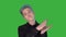 Sarcastic young man clapping hands looking at camera green screen haughty guy