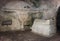 Sarcophagus and bas-relief of Menorah on the wall in the inner room of the necropolis in the Bet She`arim National Park. Kiriyat T