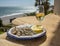 Sardines espeto prepared on skewers and open flame on fireplace with olive trees wood, served outdoor with glass of fino sherry