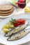 Sardinhas assadas, charcoal grilled sardines