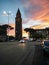 Sardinia. Carbonia. Belltower of the parrish church of St Ponziano. Backlight on the sunset sky background