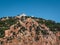 Sardinia Coastline: White Lighthouse Tower on Rocks and Cliffs n