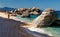 Sardinia, Italy, holidays. Cala Marilou beach near Arbatax, rocks arching out of the water.