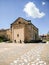 Sardinia. Mogoro. Church of the Madonna del Carmine, 14th century. Rear facade with the squared external wall of the apse