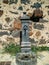 Sardinia. Mogoro. Ornamental cast iron fountain with a stone wall in the background near the Church of the Carmine