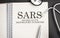 sars word written on wooden blocks and stethoscope on light background. healthcare conceptual for hospital, clinic and medical