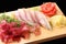 Sashimi hamachi on a board