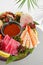 Sashimi set from raw seafood: salmon, tuna, eel, perch, shrimps, sea scallop. Traditional japanesse dish - sashimi on white