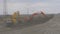 Saskatoon, Canada - May 15, 2018. Professional crawler excavators loading bould near road. View of two bulldozers