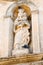 Sassi di Matera. Medieval sculptural group of three figures on the pediment of the seminary building