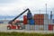 Sassnitz-Mukran, Germany, August 20, 2020: Shunting vehicle moves containers in the industrial cargo port of Sassnitz Mukran on