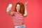 Sassy fashionable playful good-looking redhead daring curly woman show peace victory animal ears gesture winking